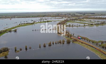 Welney, UK. 23rd Feb, 2022. The Welney wash area is beginning to fill with flood water as the levels of The Old Bedford river and River Delph are being to rise, in Welney, Norfolk, on February 23, 2022 Credit: Paul Marriott/Alamy Live News Stock Photo