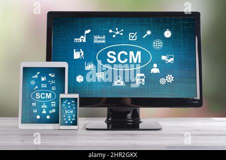 Scm concept shown on different information technology devices Stock Photo