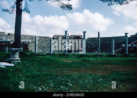 Ostia Antica - large archaeological site in progress, location of the harbour city of ancient Rome. Theatre.   Archival scan from a slide. April 1972. Stock Photo