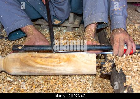 Working hands of a carpenter in the village Stock Photo