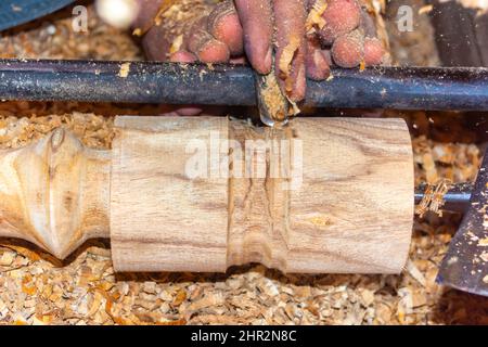 Close up of working hands of a carpenter in the Asia Stock Photo