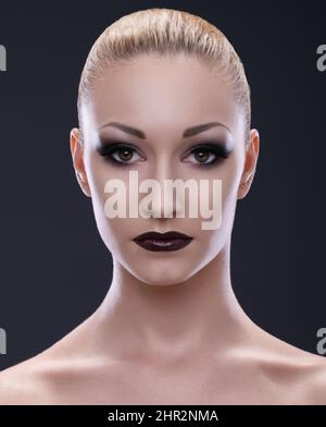 Intense beauty. Cropped portrait of a young woman wearing dark makeup. Stock Photo