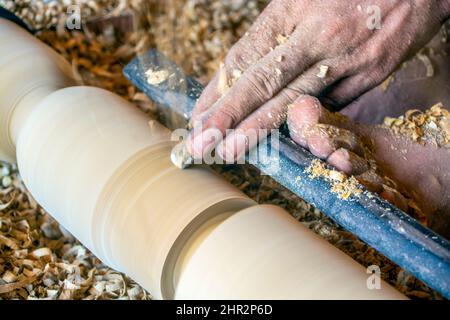 Working hands of a carpenter in the workshop Stock Photo