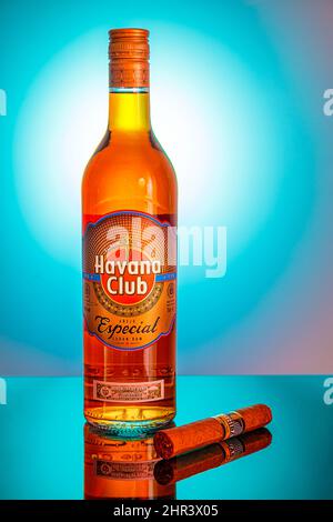 Bottle of Cuban rum on a blue background. Advertising shooting. Moscow Russia February 21, 2022. Stock Photo