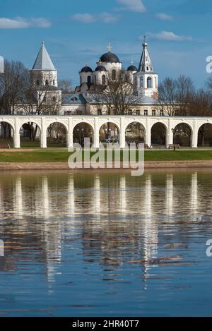 The arches of the Yaroslavovo courtyard at the Volkhov River with a reflection. Veliky Novgorod, Russia Stock Photo