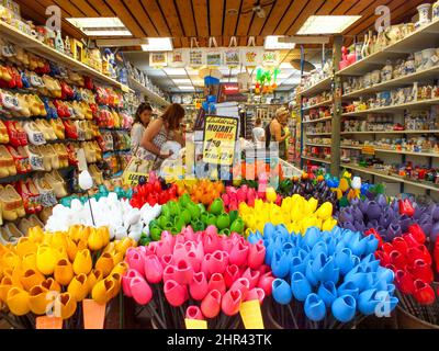 Amsterdam - May 1, 2014, Souvenir shop in Amsterdam, Holland, Netherlands, Colorful Tulips, Flower store, Mozart Tulips, people are shopping, Clogs Stock Photo