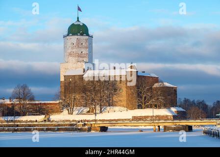 The old Vyborg Castle on a frosty February evening. Leningrad Region, Russia Stock Photo