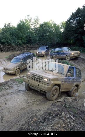Four 4x4 SUV vehicles being tested off road Stock Photo - Alamy