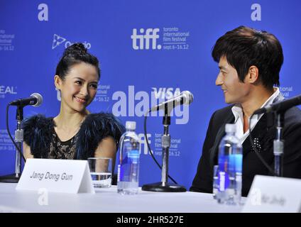 Korean actor Jang Dong-gun, right, sits alongside Chinese actress Zhang Ziyi during the press conference for the film 'Dangerous Liaisons' during the 2012 Toronto International Film Festival in Toronto on Monday, Sept. 10, 2012. (AP Photo/The Canadian Press, Aaron Vincent Elkaim)