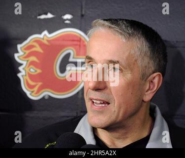 Calgary Flames coach Bob Hartley poses with the Jack Adams Award trophy ...