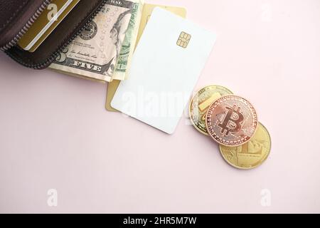 dhaka, bangladesh, 23th may 2021.golden bitcoins and wallet on laptop  Stock Photo