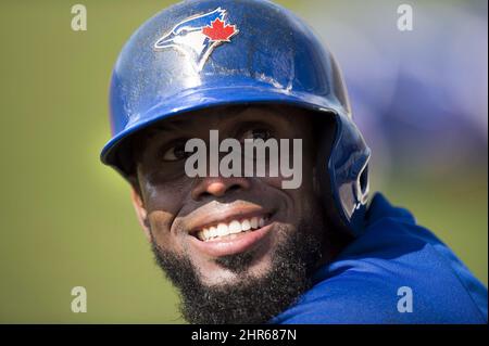 Toronto Blue Jays' Jose Reyes stands at second base after hitting a stand  up double as Texas Rangers' Elvis Andrus looks on and second base umpire  Chris Conroy calls for time during