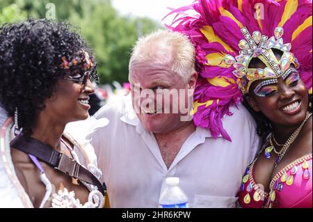 Toronto Mayor Rob Ford participates in the Scotiabank Caribbean Carnival in Toronto on Saturday, Aug. 2, 2014. Commonly called Caribana, the event culminated Saturday with its annual parade, which typically bustles with colourful costumes, upbeat music and dancing in the streets. THE CANADIAN PRESS/Victor Biro