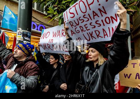 Istanbul, Turkey. 25th Feb, 2022. Protesters hold placards expressing their opinions during the demonstration.As a response to the Russian invasion of Ukraine, Ukrainian citizens gathered in front of the Russian consulate on Istiklal street in Istanbul, Turkey to protest the war. Credit: SOPA Images Limited/Alamy Live News Stock Photo