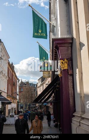 Rolex flags and sign high up outside jewellers on london Street Norwich Stock Photo