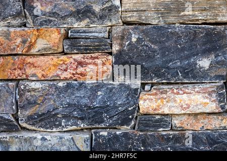 Walls made of multicolor stones , Stone background. Ancient stone wall. Grunge stone wall backdrop. Background of old vintage stone wall. Wall decorat Stock Photo