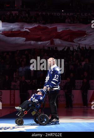 Former Toronto Maple Leaf Mats Sundin and his wife, Josephine Johansson,  watch as his No. 13 is raised to the rafters prior to an NHL hockey game  between the Maple Leafs and