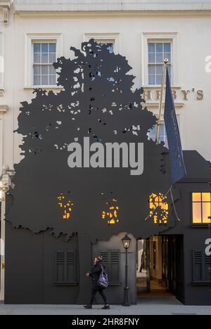 Sotheby's, New Bond Street, London, UK. 25th Feb, 2022. Image: Sotheby's exterior features an installation replicating the René Magritte painting L'empire des lumières. The original painting is offered for sale in the Evening Auction on 2 March in London. René Magritte, L'empire des lumières, 1961. Estimate upon request (estimate in excess of £45 million). Credit: Malcolm Park/Alamy Live News Stock Photo