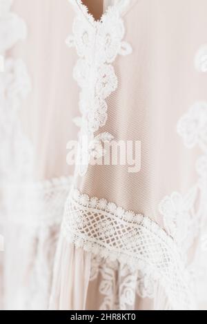 Vertical closeup shot of lace details on a dress Stock Photo