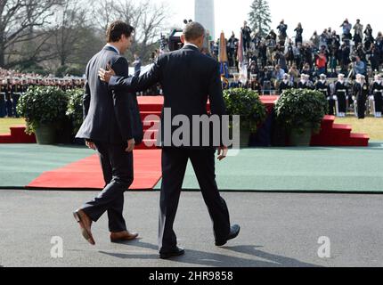 President Barack Obama, right, greets Buzz Aldrin, left, Michael