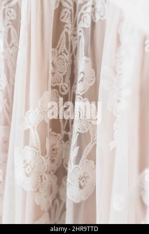 Vertical closeup shot of lace details on a dress Stock Photo
