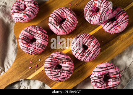 Homemade Valentines Day Donuts with Chocolate and Sprinkles Stock Photo