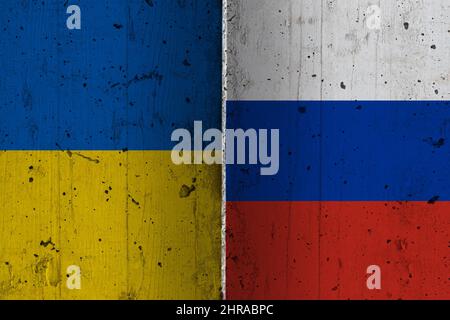 Ukraine and Russia national flags on a grunge texture symbolising war and conflict. Stock Photo