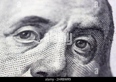 United states hundred dollars money bill, Benjamin Franklin's eyes from a fragment of new 100 dollar Stock Photo