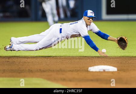 Toronto Blue Jays' Ryan Goins blows a bubble during the third inning of a  baseball game against the Boston Red Sox at Fenway Park in Boston Saturday,  June 13, 2015. (AP Photo/Winslow