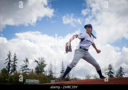 Pitcher Claire Eccles, 19, sports a tattoo of a baseball behind her right  ear as she