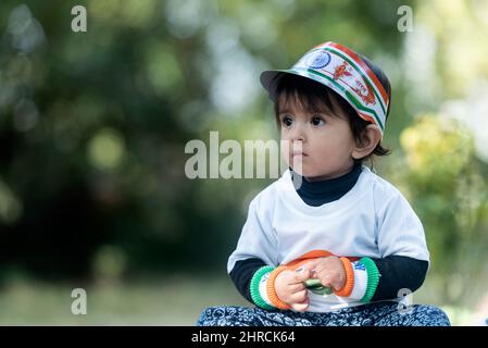 Adorable proud Indian child with an Indian flag and flag shirt Stock Photo