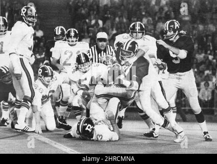 Toronto Argonauts players look at the CFL East division trophy after  defeating the Montreal Alouettes in