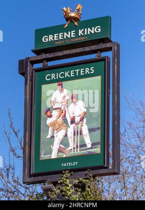 Traditional hanging pub sign at The Cricketers a Greene King public house, Cricket Hill Lane, Yateley, Hampshire, England, UK Stock Photo