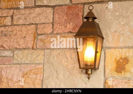 Closeup shot of a vintage lamp on the wall Stock Photo
