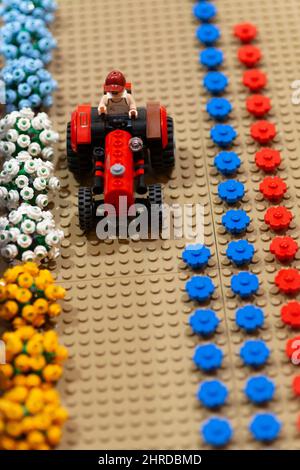 Lego Farmer Driving Tractor Stock Photo - Alamy