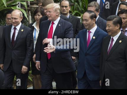 Russian President Vladimir Putin(left), United States President Donald Trump, Vietnamese President Tran Dai Quang and Chinese President Xi Jinping(right) walk to the group photo at the APEC Summit in Danang, Vietnam Saturday November 11, 2017. THE CANADIAN PRESS/Adrian Wyld