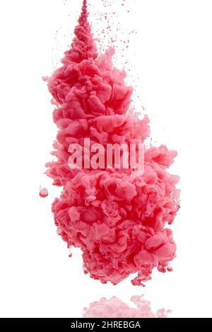 Its an explosion of color. Studio shot of pink ink in water against a white background. Stock Photo