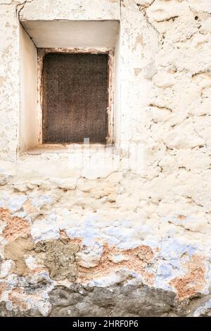 Old chipped house facade with little window Stock Photo - Alamy