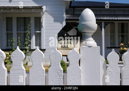 Beautiful shot of a white fence of a house during the day Stock Photo