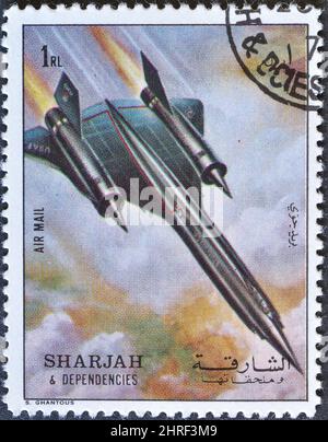 Cancelled postage stamp printed by Sharjah and dependencies, that shows Supersonic Aircraft, Record Attempt, circa 1972. Stock Photo