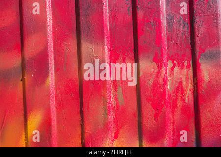 red and yellow spray painted corrugated metal background Stock Photo