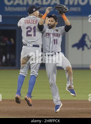 New York Mets' Jose Bautista, right, visits with Little League