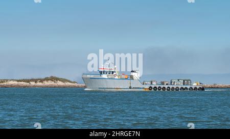 PORT ARANSAS, TX - 29 JAN 2020 - The MISS JULIE, a reserved commercial boat sails on the shipping channel between the Gulf of Mexico and Corpus Christ Stock Photo