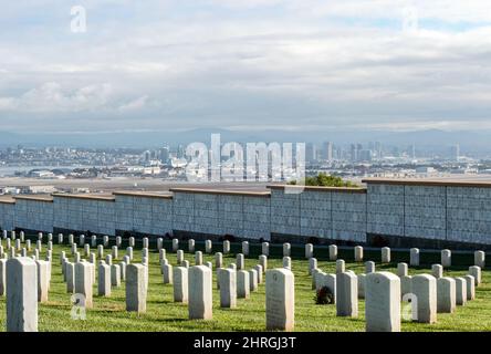 Shot of Headstones at Fort Rosecrans National Cemetery with the ocean in the background Stock Photo