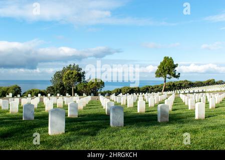 Shot of Headstones at Fort Rosecrans National Cemetery with the ocean in the background Stock Photo