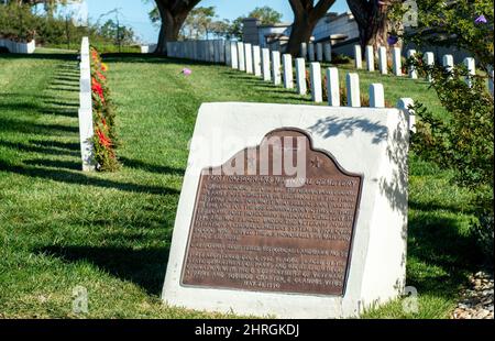 Shot of Headstones at Fort Rosecrans National Cemetery with the ocean in the background Stock Photo