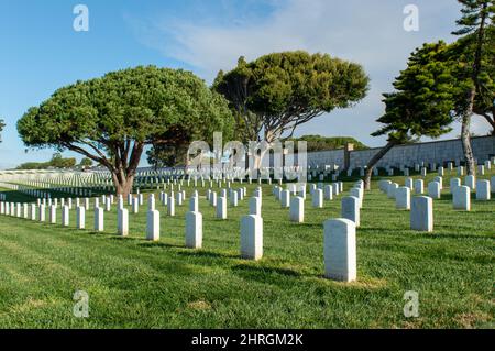 Shot of Headstones at Fort Rosecrans National Cemetery with the ocean in the background Stock Photo