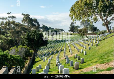 Shot of Headstones at Fort Rosecrans National Cemetery with the ocean in the background Stock Photo