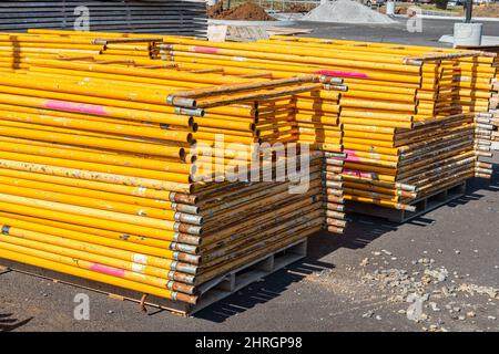 Horizontal shot of stacked scaffolding at a new construction job site. Stock Photo