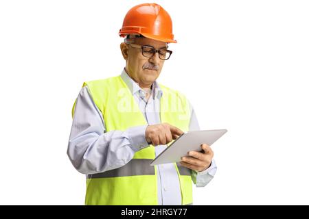 Mature construction site engineer using a tablet isolated on white background Stock Photo
